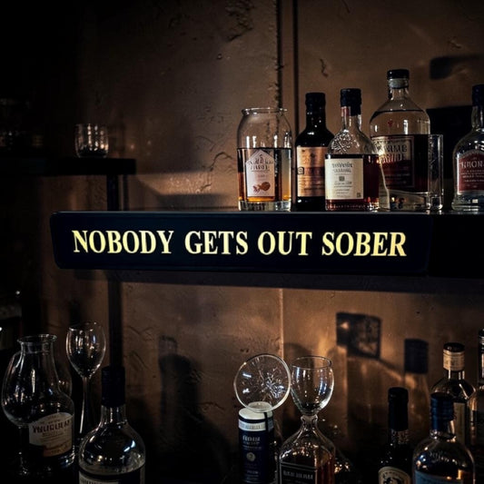 Black & Gold “Nobody Gets Out Sober” Wall Sign – Humorous Statement Décor