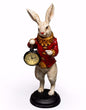 The White Standing Clock Figure with Red Jacket  Height: 35cm Width: 11cm Depth: 11cm