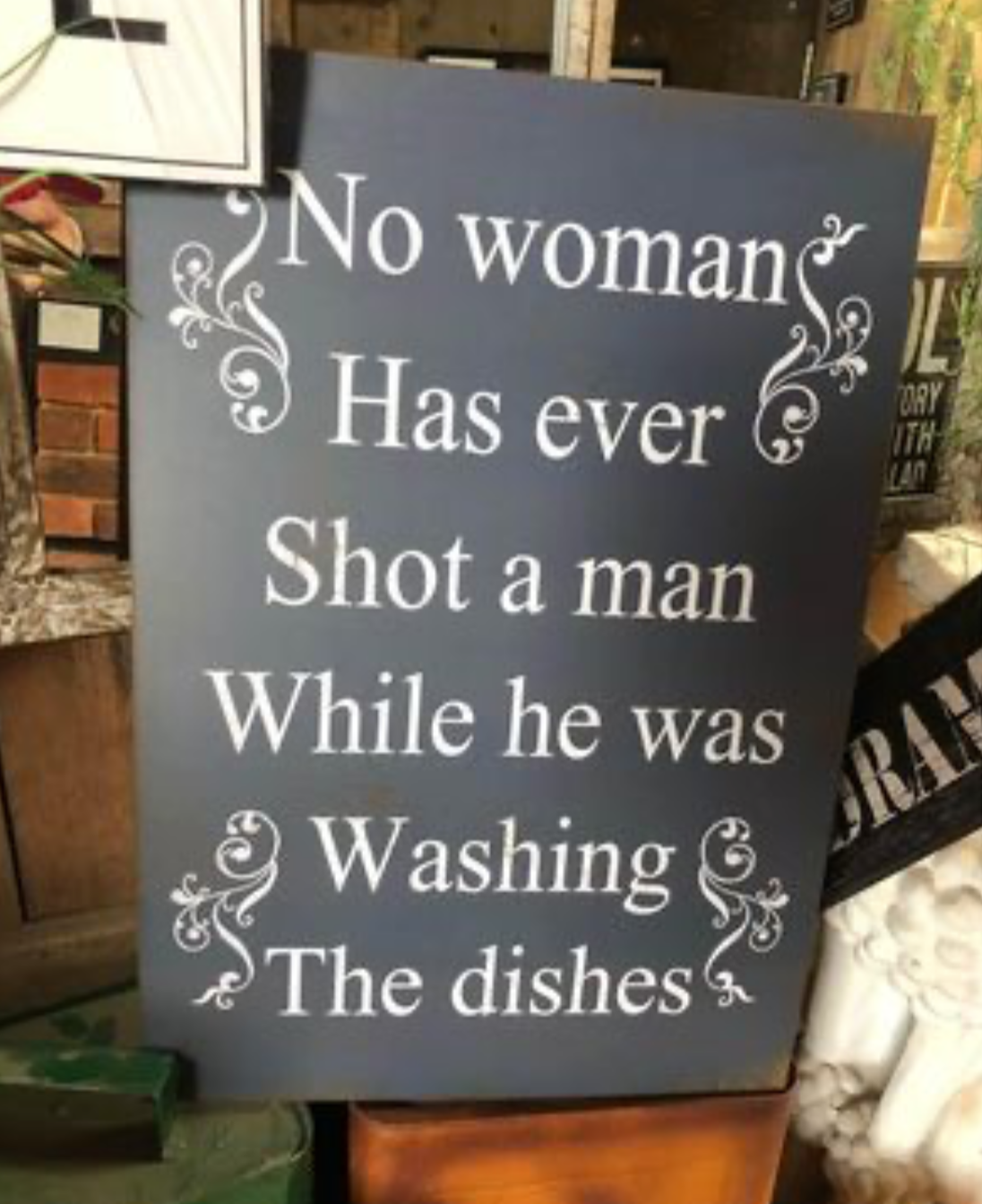 "No Woman Has Ever Shot a Man While He Was Washing the Dishes" Metal Sign - Comical Home Decor | Sign of the times Stoke