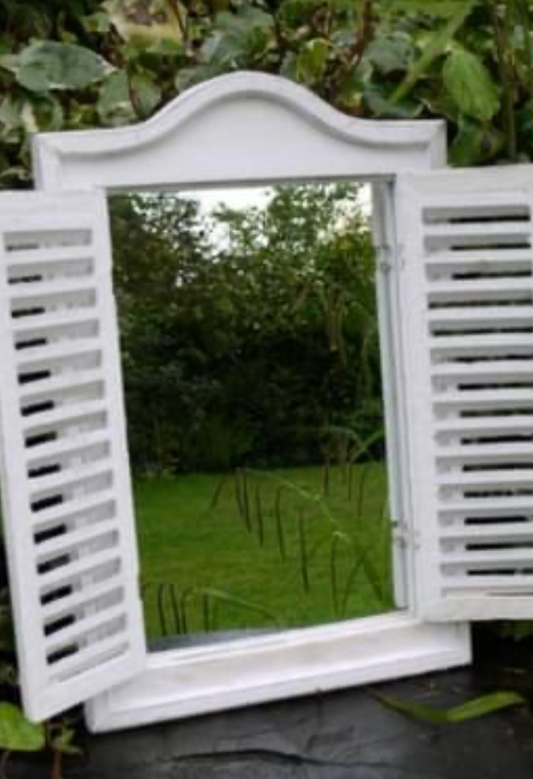 Mirror with shutters